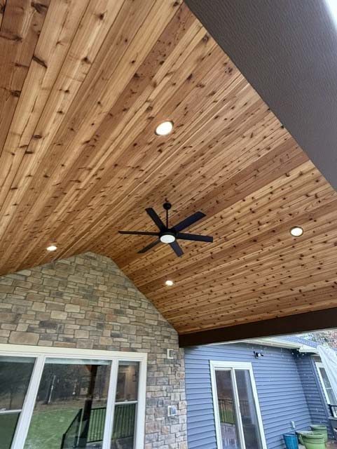 Wood-paneled ceiling with recessed lights, installed by a licensed & insured electrician.